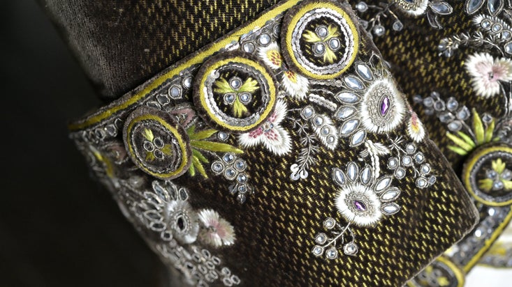 A decorative sleeve on a coat in the costume collection at Calke Abbey Derbyshire